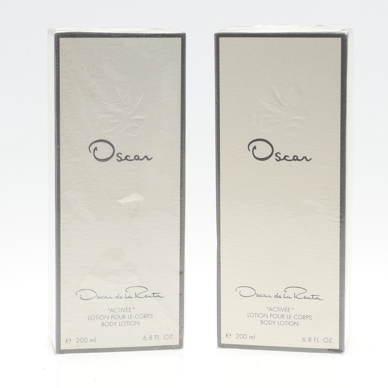 TWO OSCAR DE LA RENTA 'ACTIVÉE' BODY LOTION.