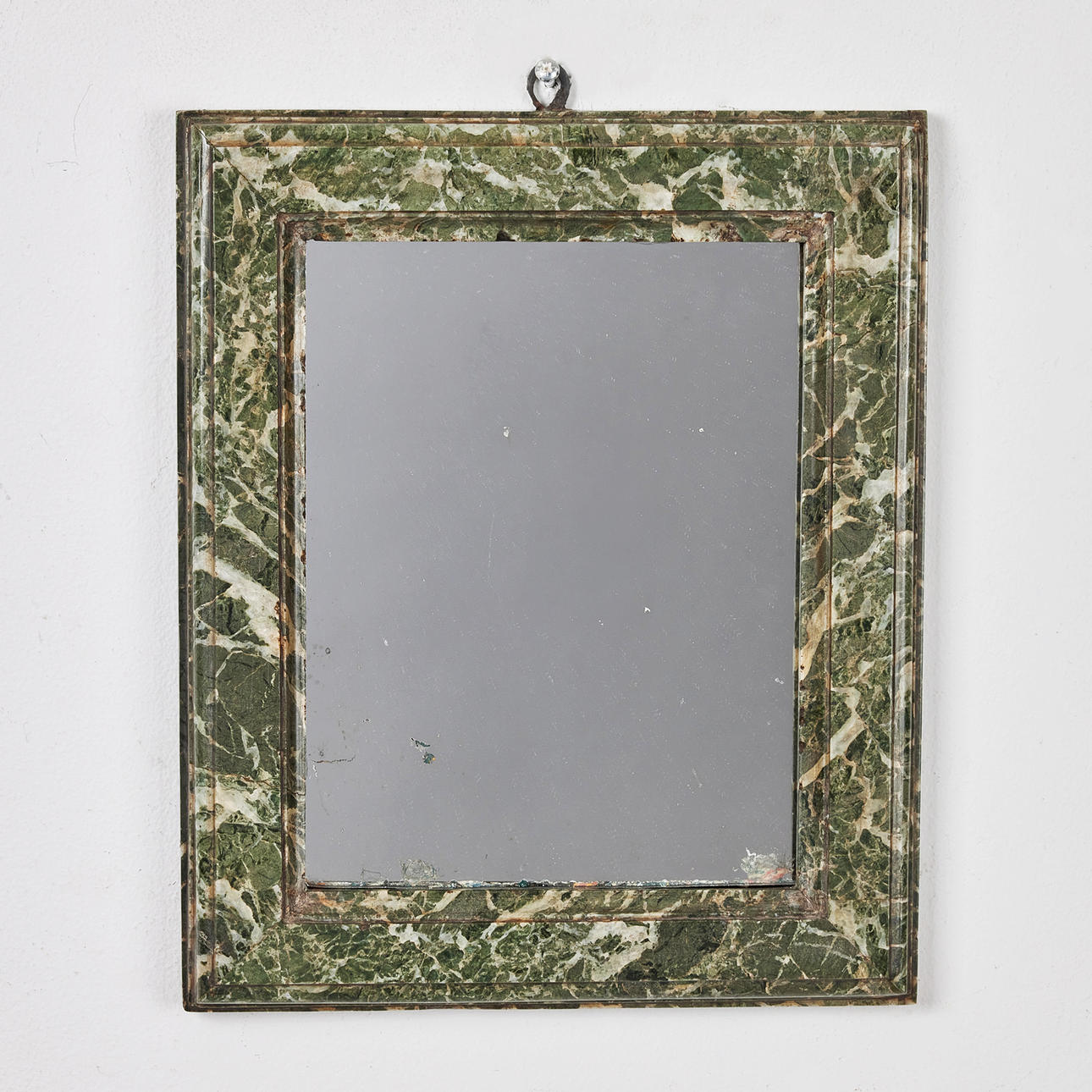 MIRROR, 19th century, veneered with marble, profiled decor, mercury foiled glass, wrought iron suspension.