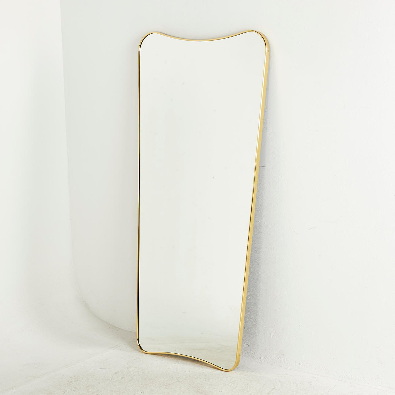 GIO PONTI. Wall mirror, "FA33 Mirror", Gubi, brass frame.