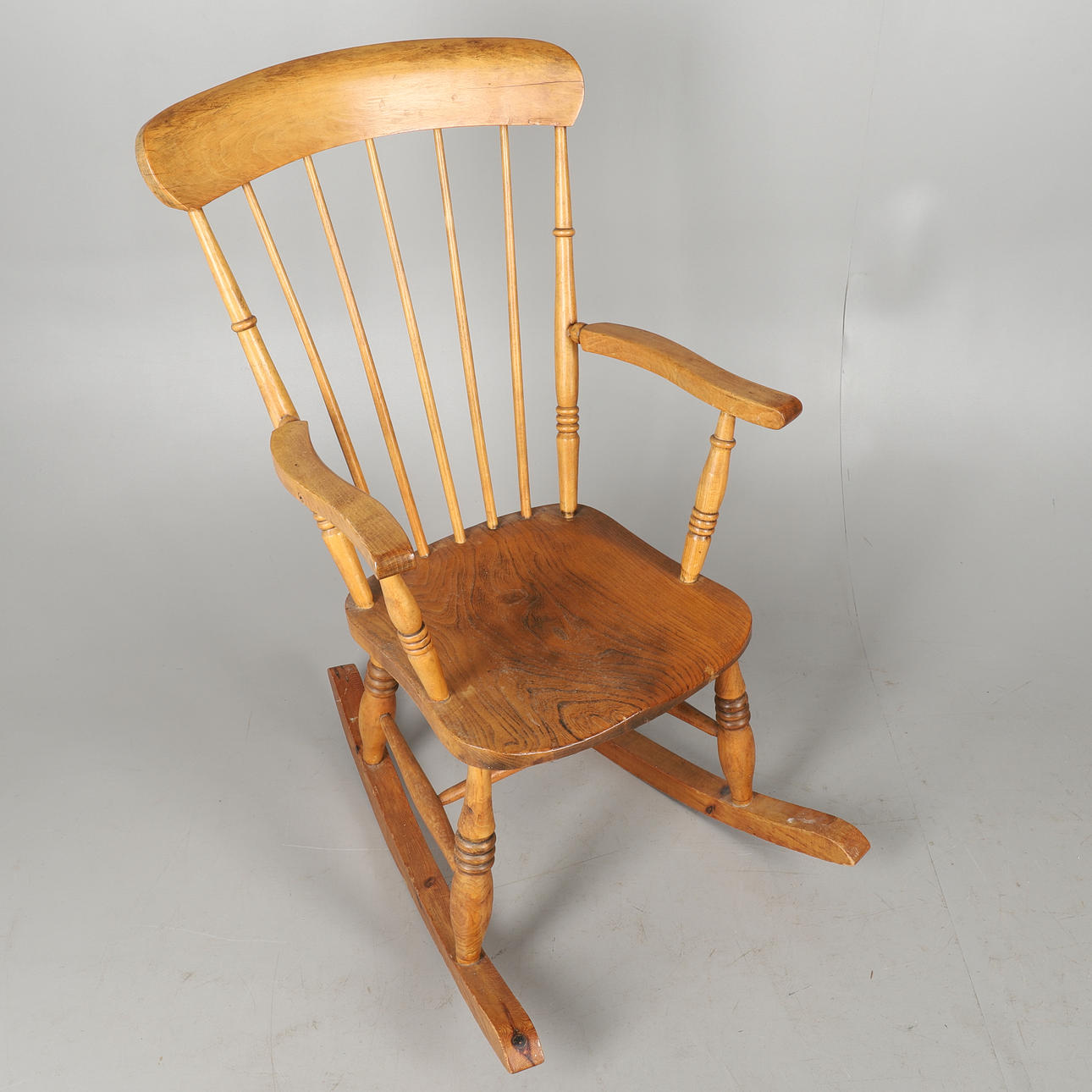 A MODERN PINE AND ELM SEATED STICK BACK ROCKING CHAIR. Furniture ...