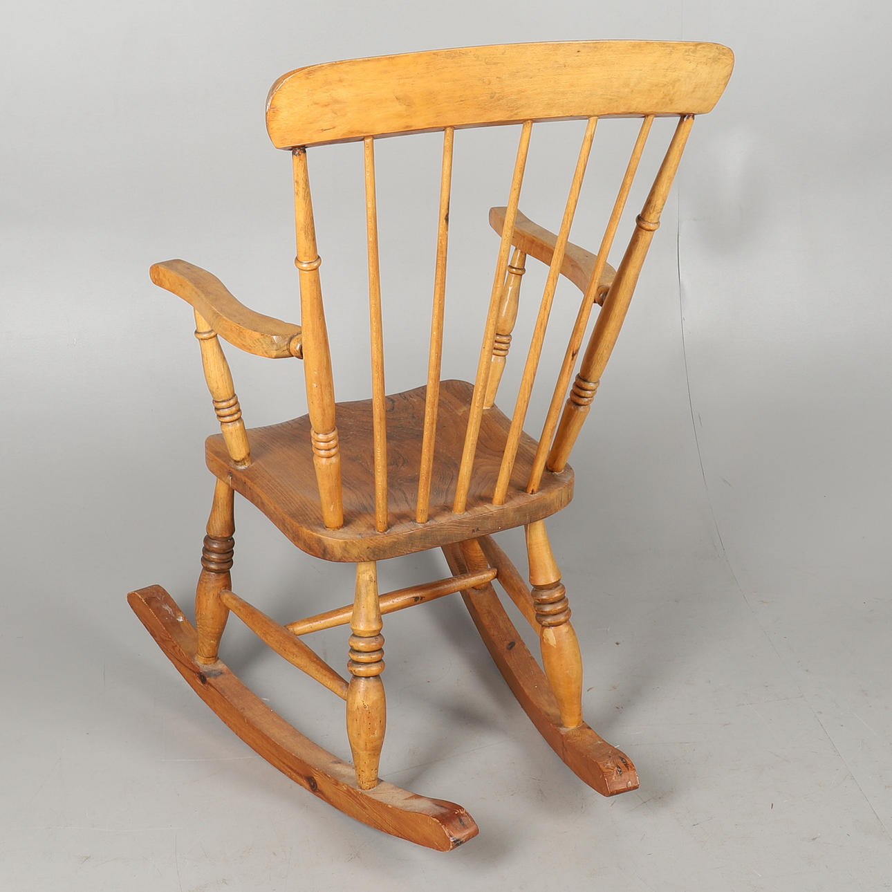 A MODERN PINE AND ELM SEATED STICK BACK ROCKING CHAIR. Furniture ...