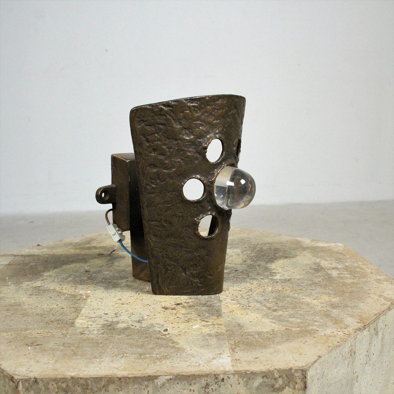 Brutalist bronze wall lamp.