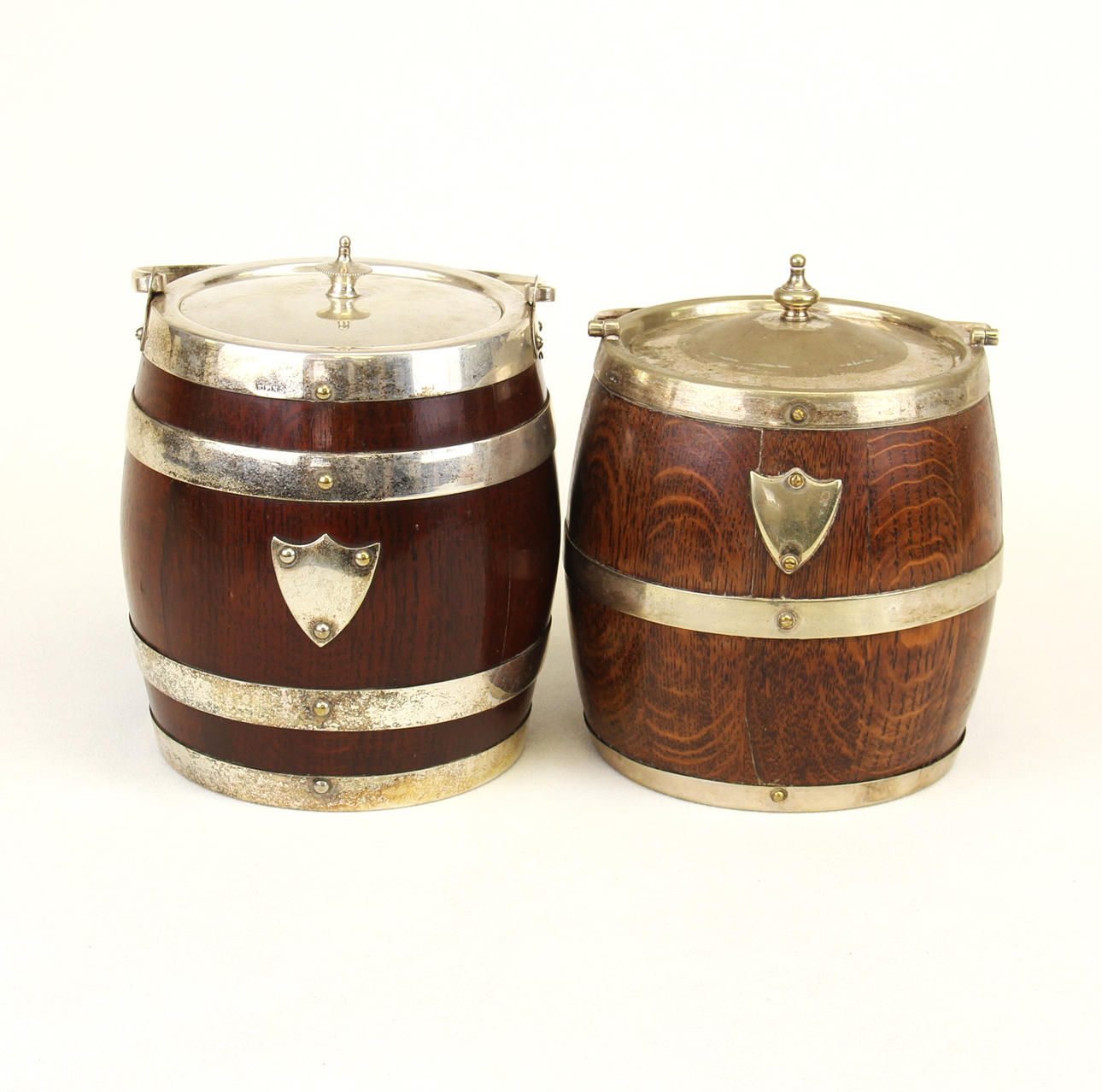 ANTIQUE OAK & SILVER PLATED BISCUIT BARRELS.