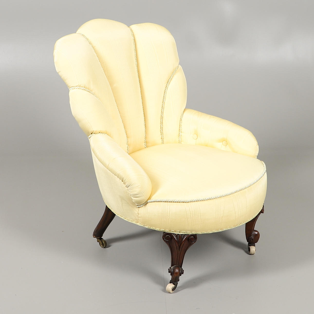 A VICTORIAN YELLOW SHELL BACK ARMCHAIR.