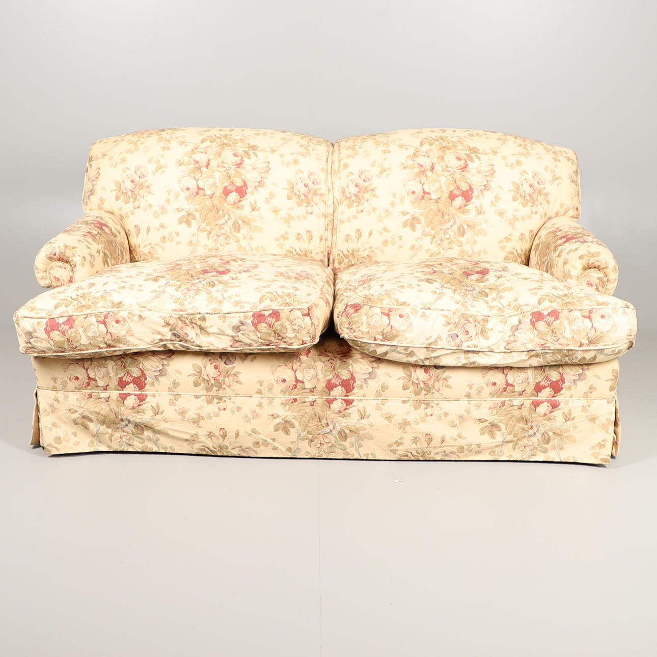 A GEORGE SMITH SOFA COVERED IN BENNISON FABRIC.