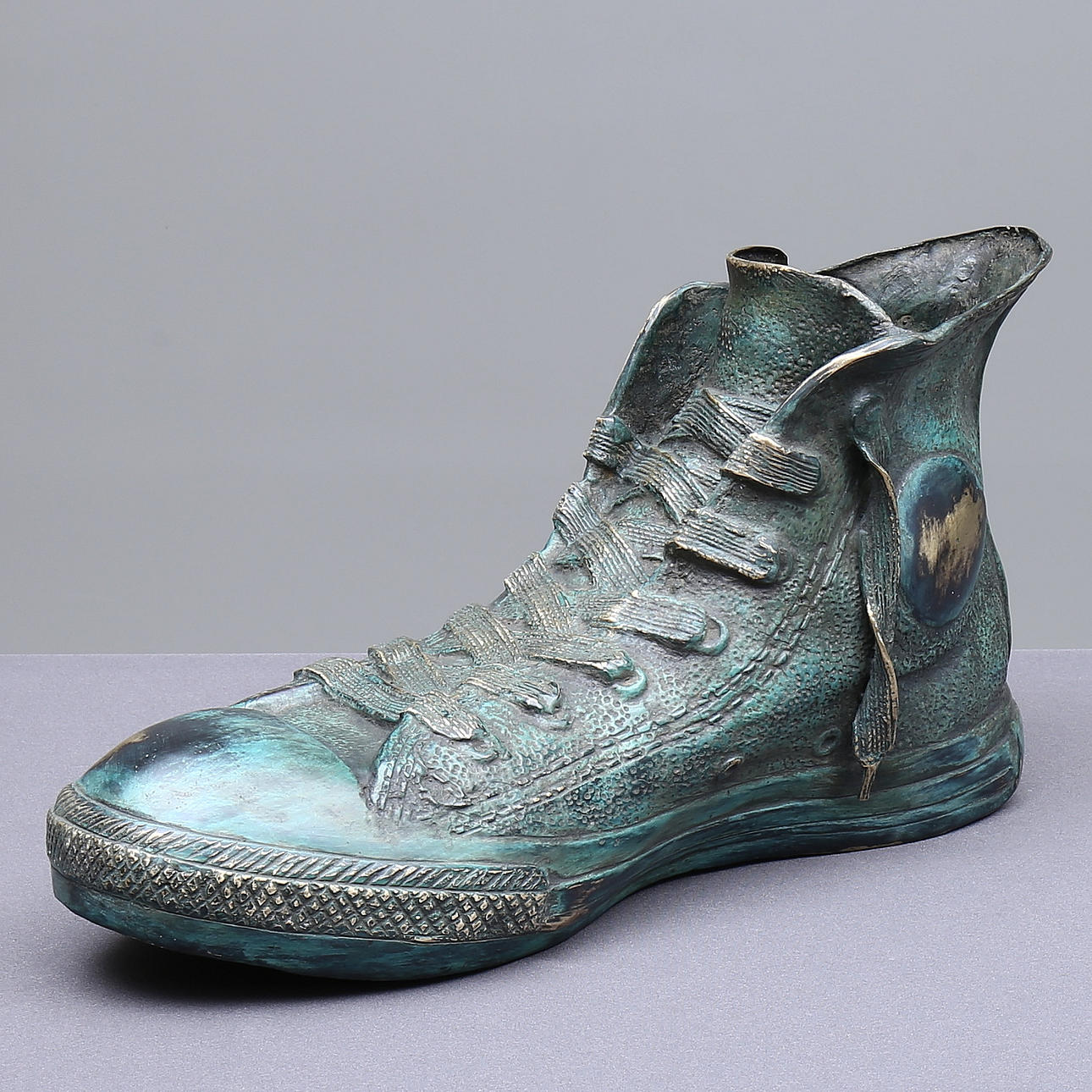 SCULPTURE, shoe, green patinated bronze, unsigned.