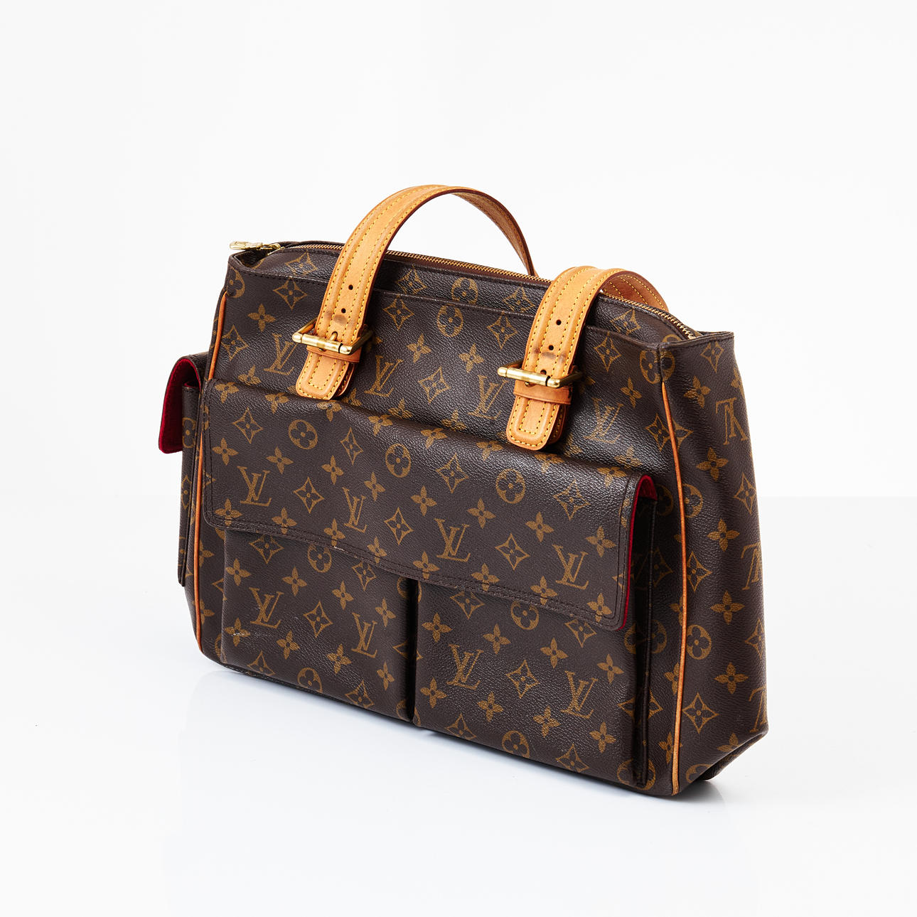 LOUIS VUITTON, "Multiple Cite", bag, monogram canvas, lined, details in leather and gold-colored brass, 3 outer pockets and 3 compartments inside, marked LOUIS VUITTON PARIS made in France.