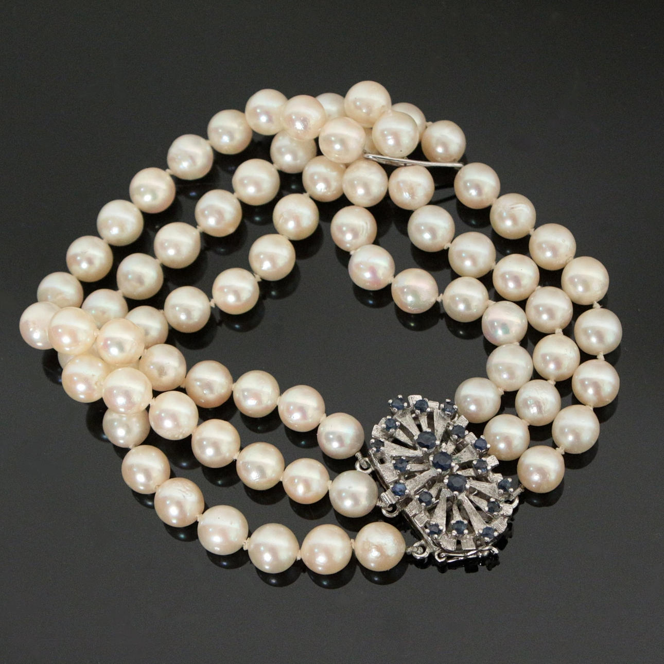 Three row pearl bracelet set with sapphires.