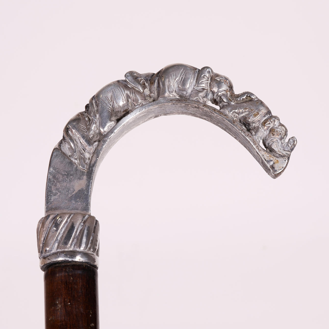 WOODEN CANE WITH SILVER HANDLE.