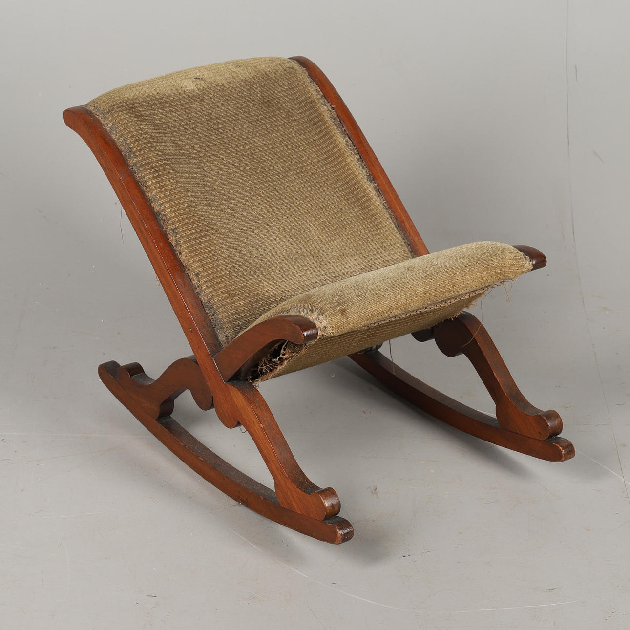 A MAHOGANY GOUT ROCKING STOOL.