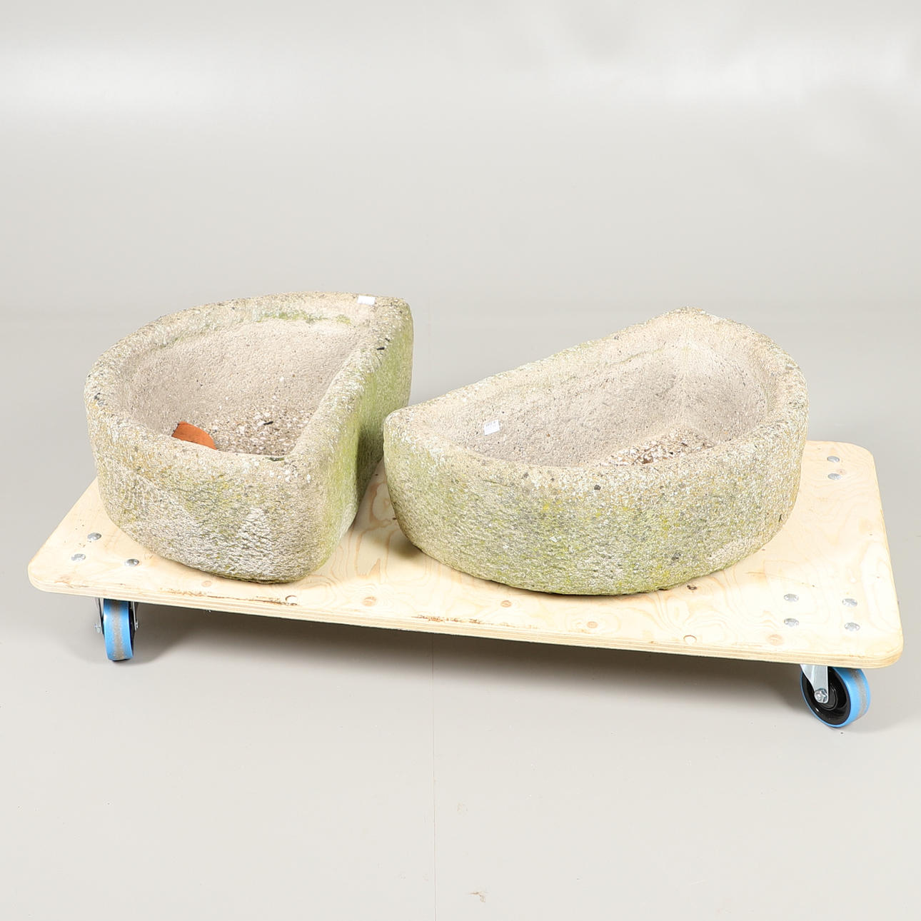 TWO SEMI-CIRCULAR STONEWARE PLANTERS.