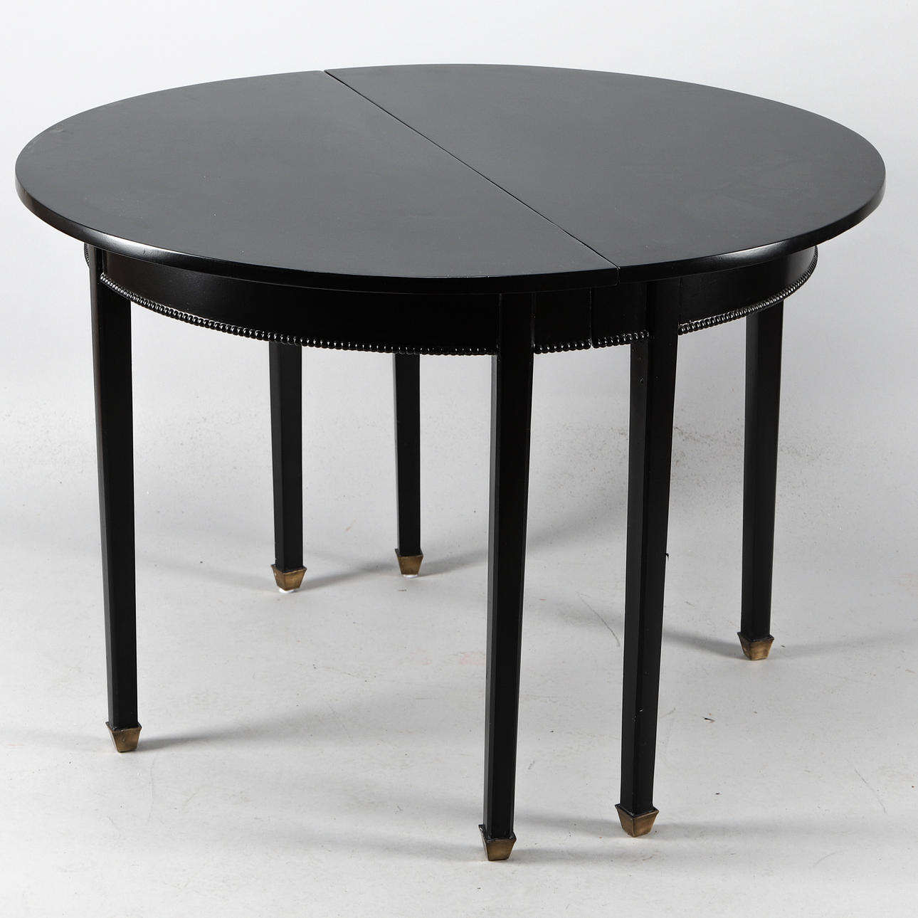 HALF-MOON TABLE, 2 pcs, black lacquered, 1900s.