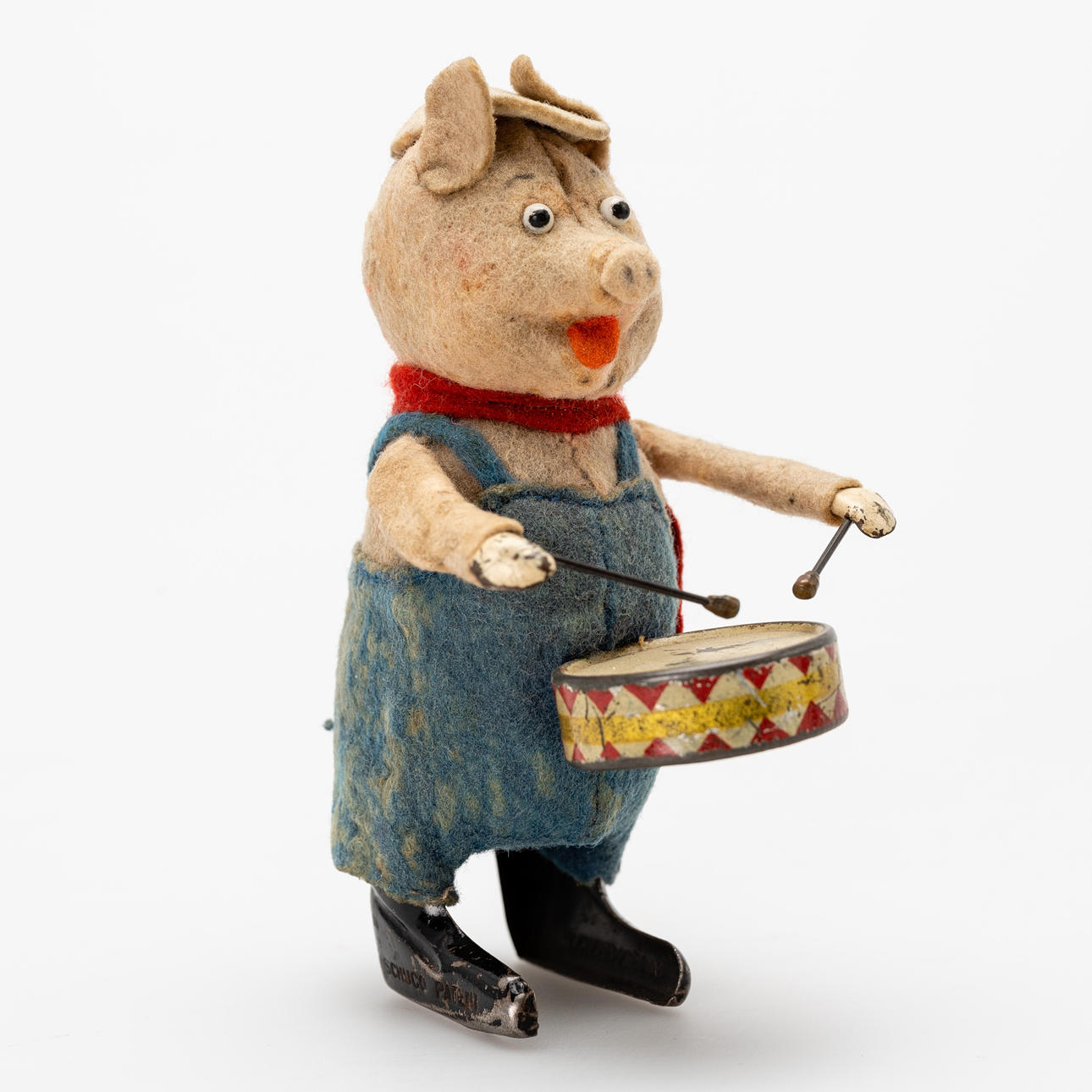 SCHUCO. Wind-up pig with a drum.