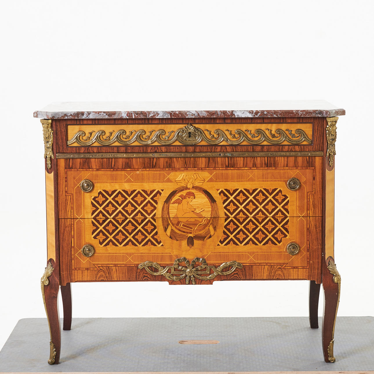Chest of drawers, first half of the 20th century, marquetry, stone slab.
