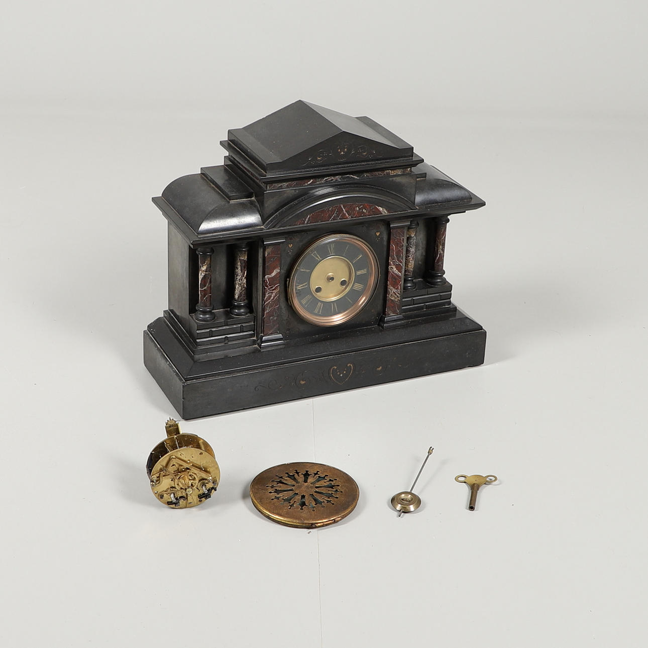 A SLATE MANTLE CLOCK.