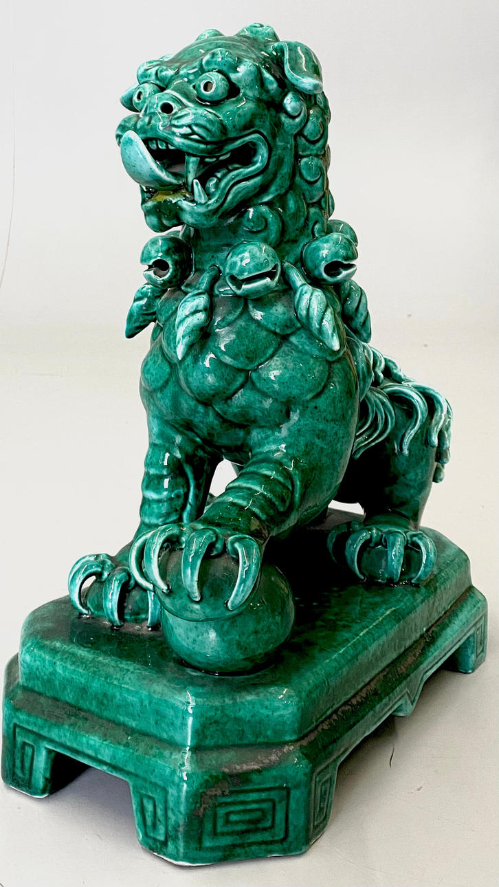 LARGE WATER GREEN GLAZED PORCELAIN FOO DOG.