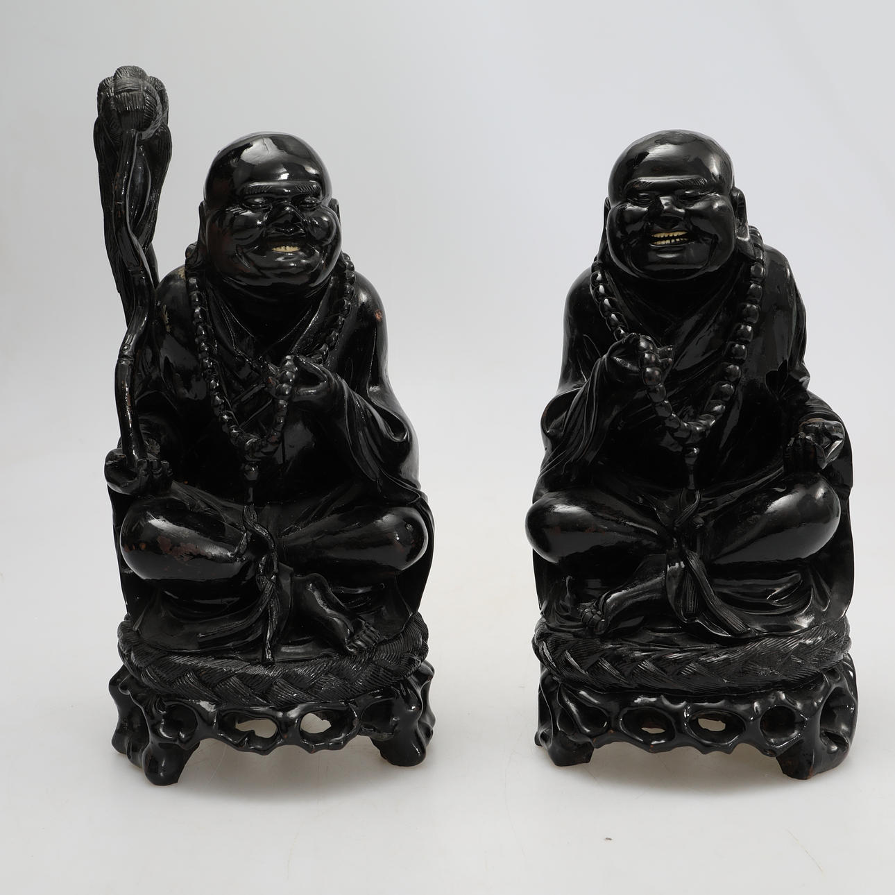 FIGURES, 2 smiling Buddha figures, wood.