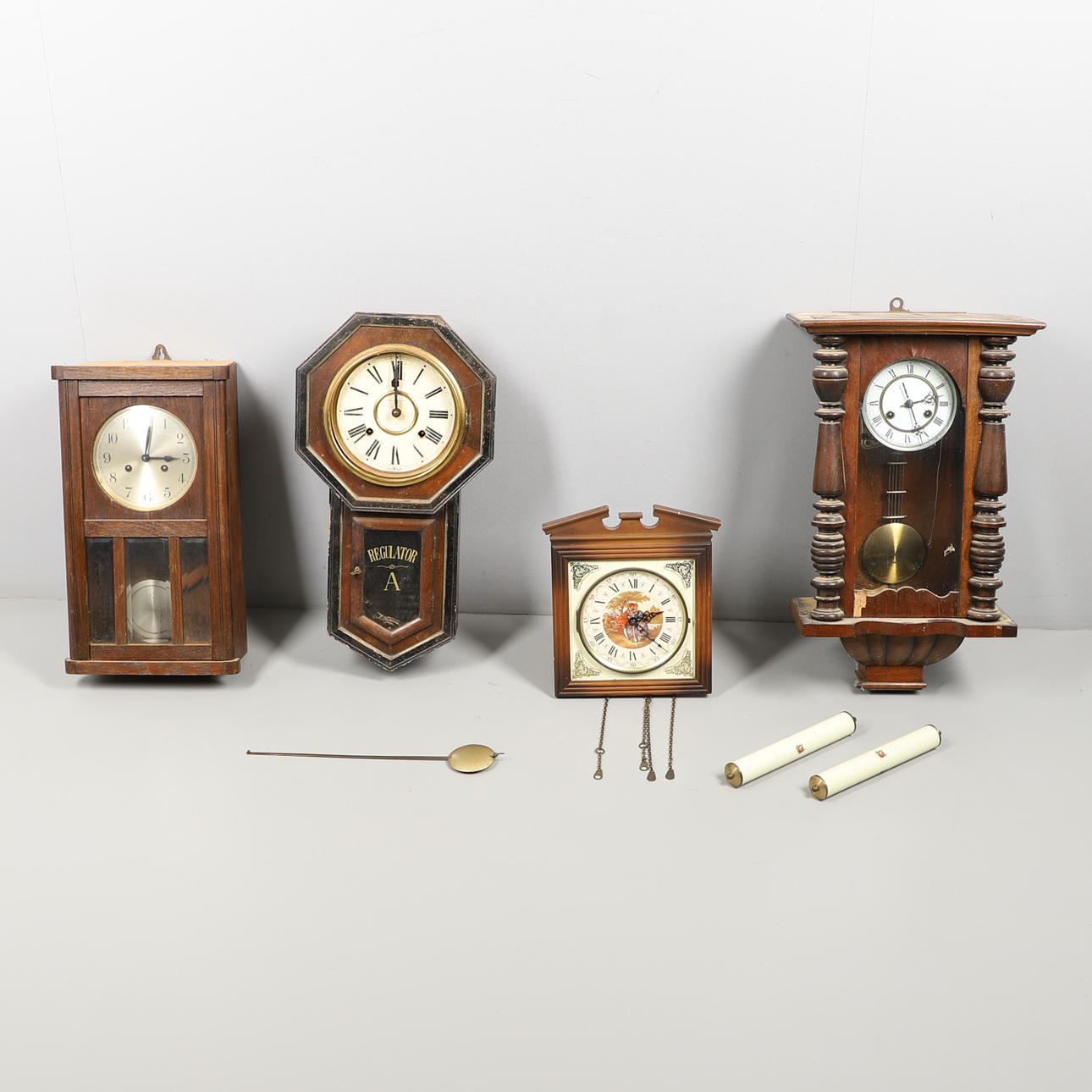 FOUR WALL MOUNTED CLOCKS.