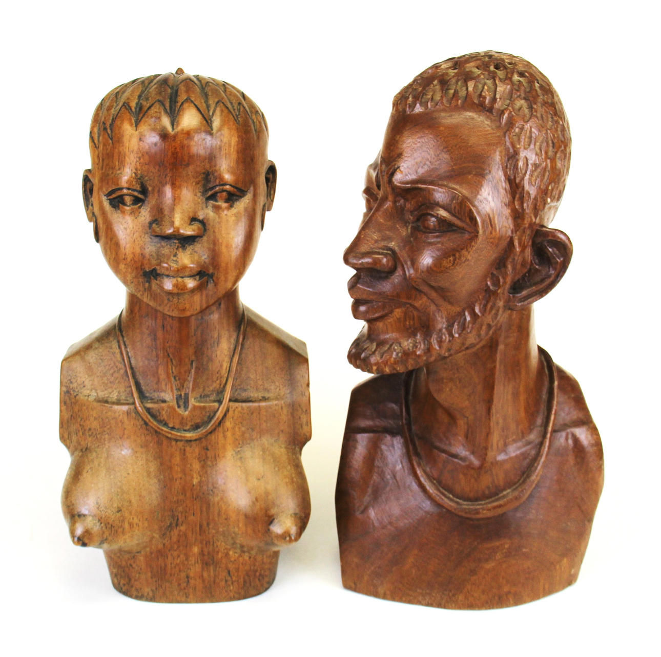 PAREJA DE BUSTOS AFRICANOS TALLADOS.