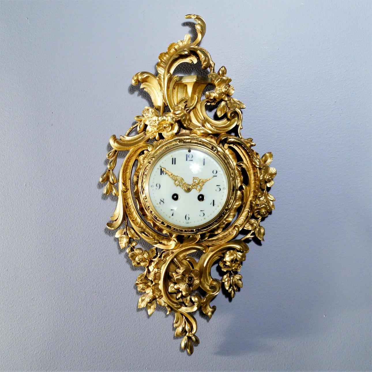FRENCH WALL PENDULUM IN GILT BRONZE.