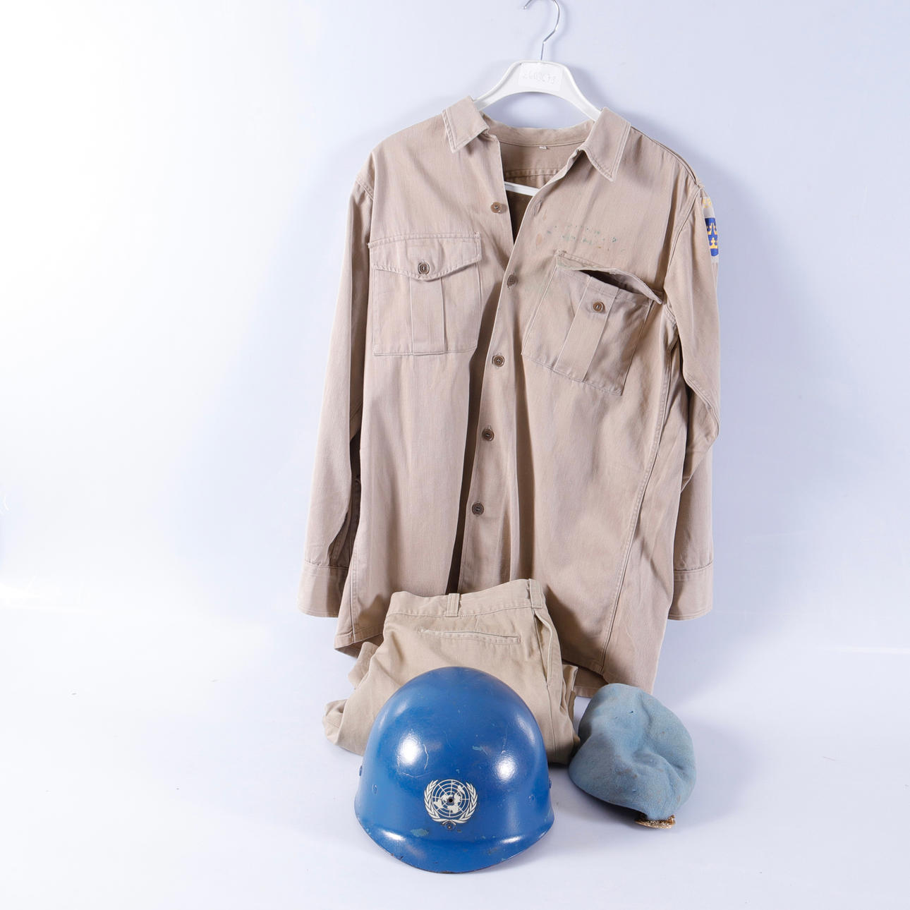 HELMET and uniform, 1960s.