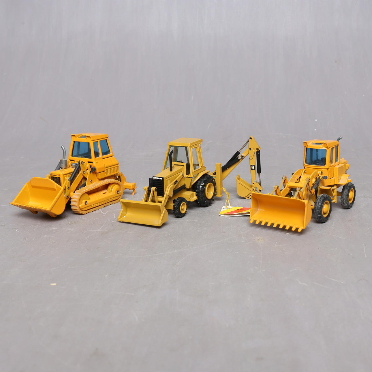 CATERPILLAR, track loader 955L, wheel loader 920 and backhoe 428, scale 1:50.