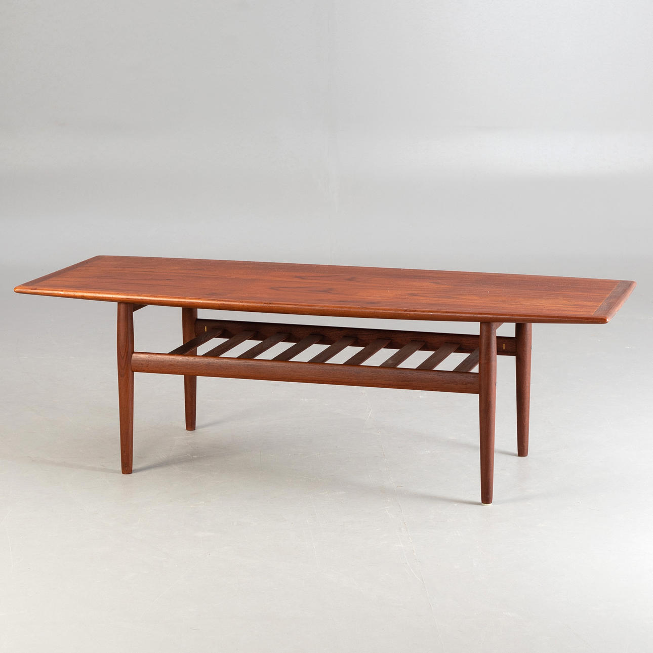 GRETE JALK. Teak coffee table. Denmark, 1960s.