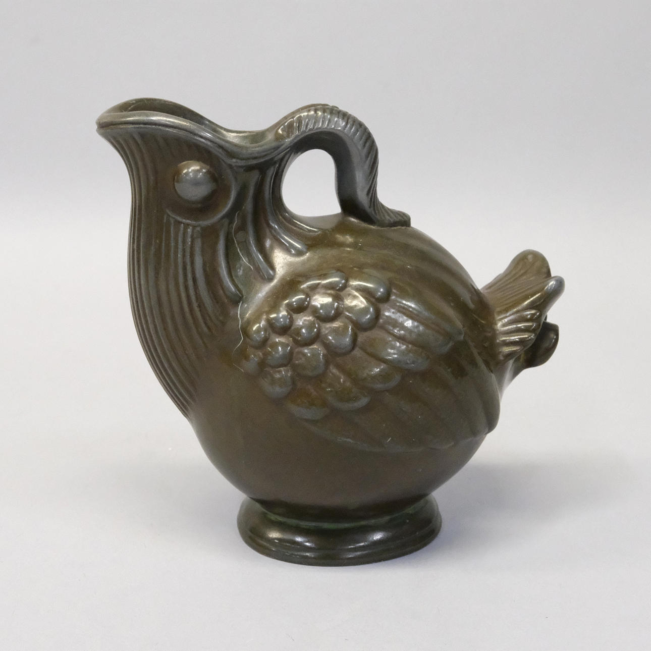 JUST ANDERSEN. VAS I BRONSERAD METALL.