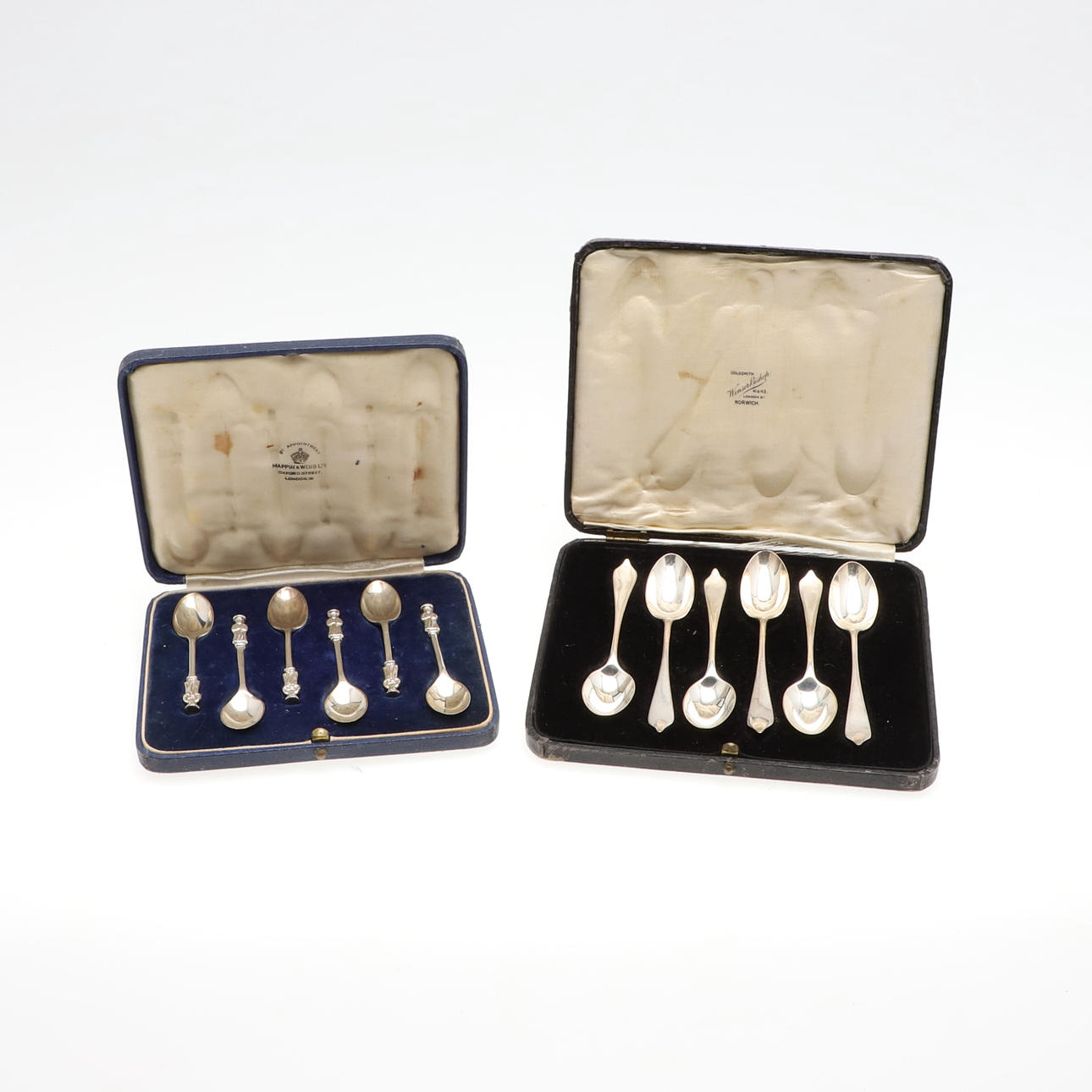TWO CASED SETS OF SILVER SPOONS.