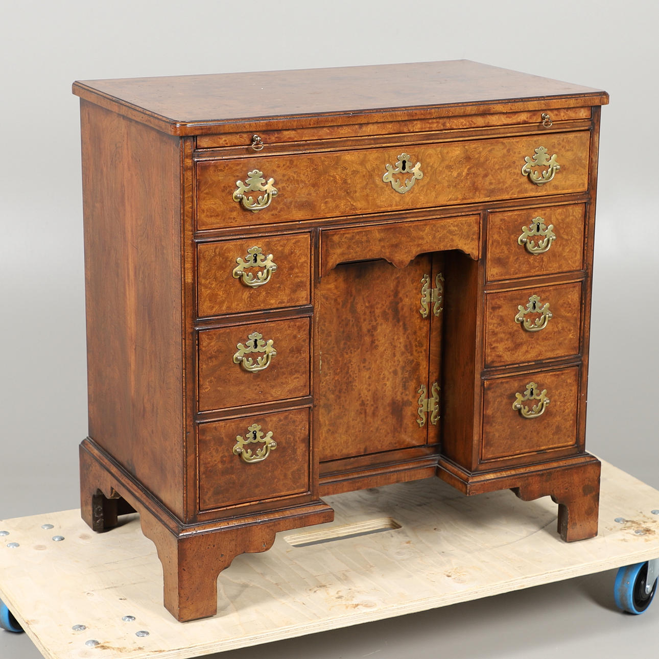 A19THC WALNUT KNEEHOLE DESK.