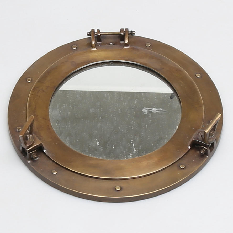 SPEGEL i form av skeppsfönster, mässing, modern tillverkning.