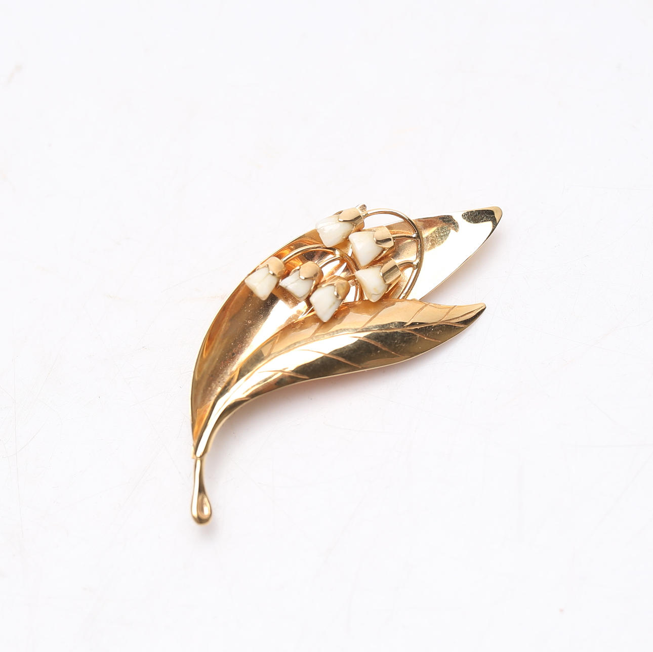 BROSCH, 18k guld samt tänder, total vikt ca. 12,3 gram.