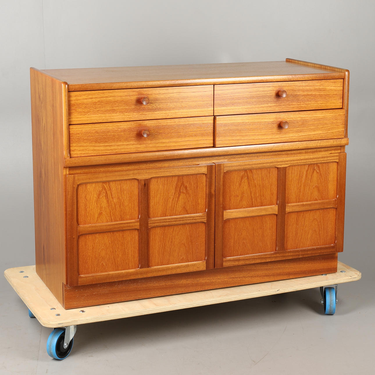 A NATHAN 'SQUARES' TEAK LOW FOUR DRAWER UNIT.