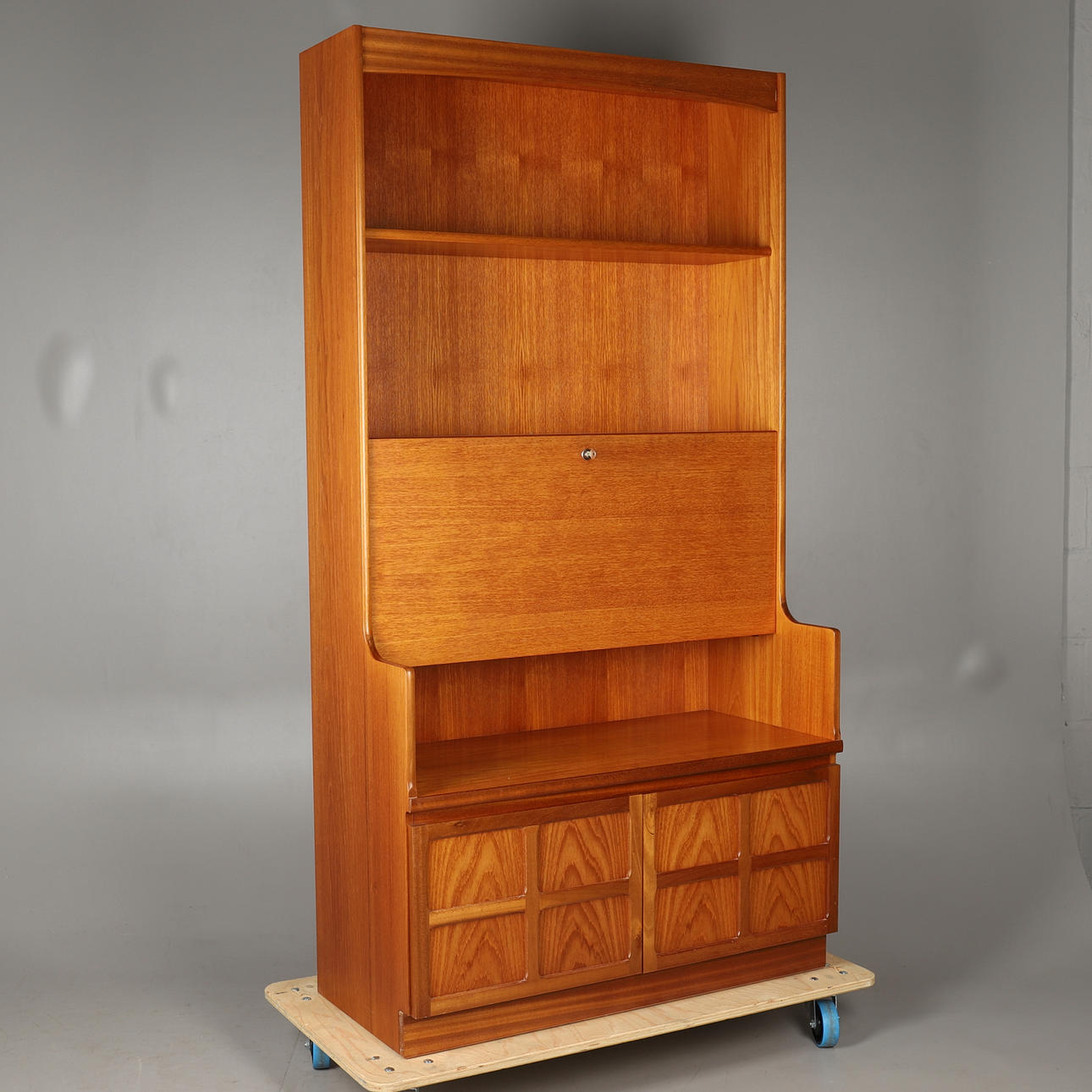 A NATHAN 'SQUARES' TEAK DRINKS CABINET.