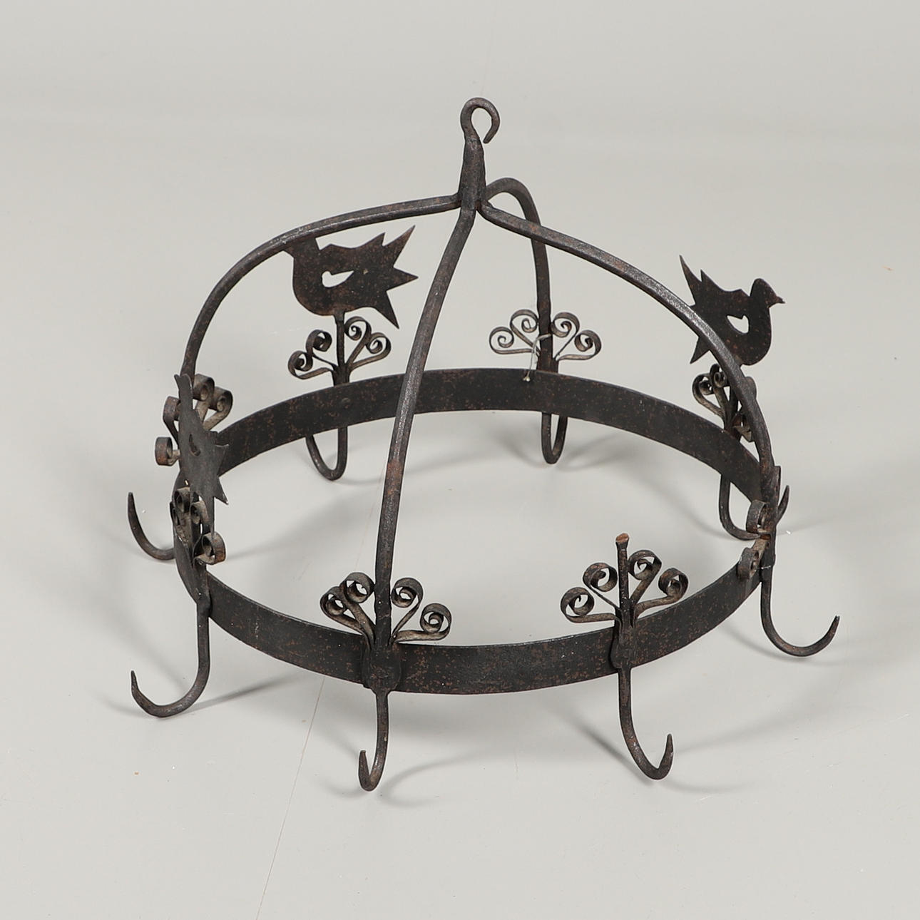 A FOLK ART WROUGHT IRON GAME HOOK.