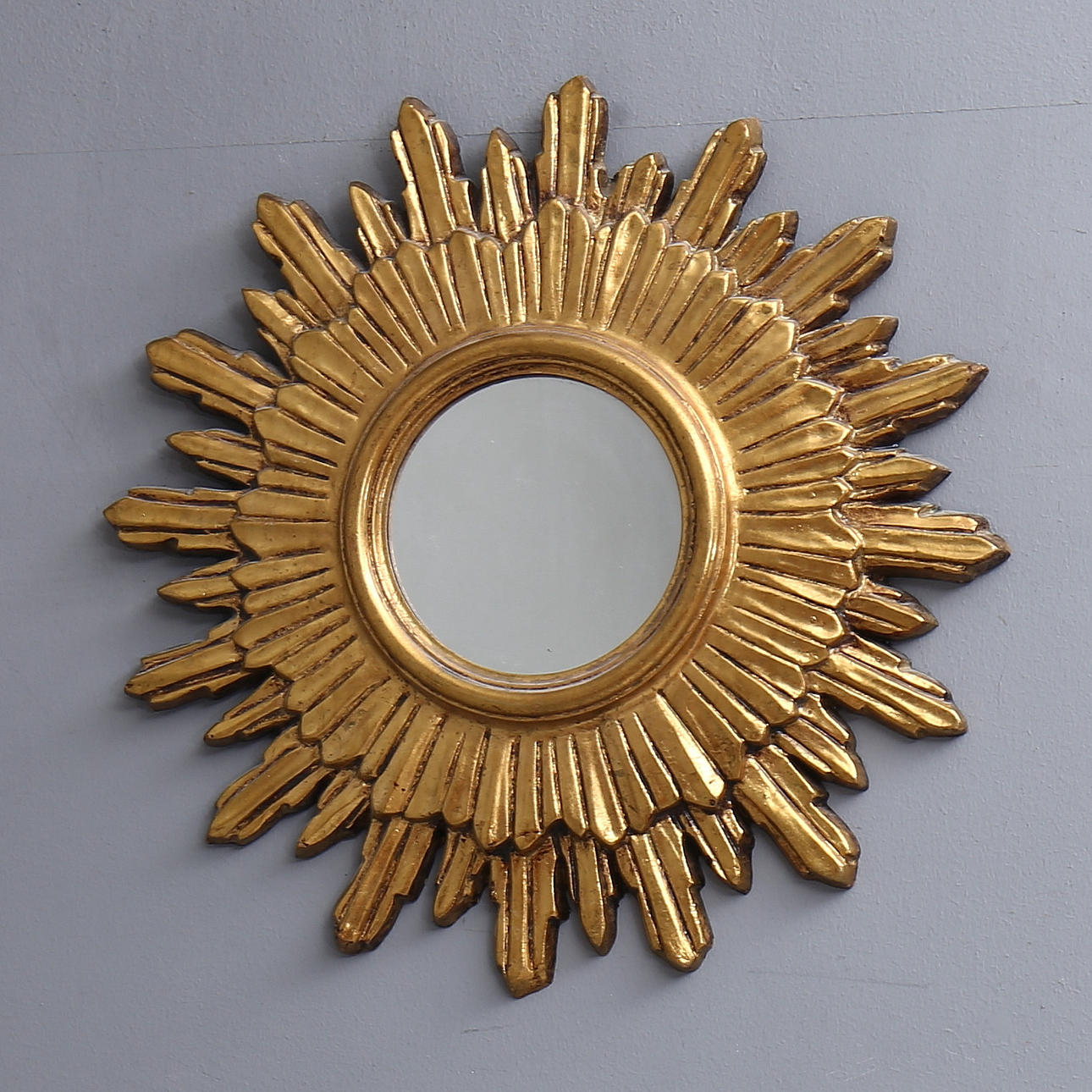 ESPEJO SOL, plástico bronceado, siglo XX.