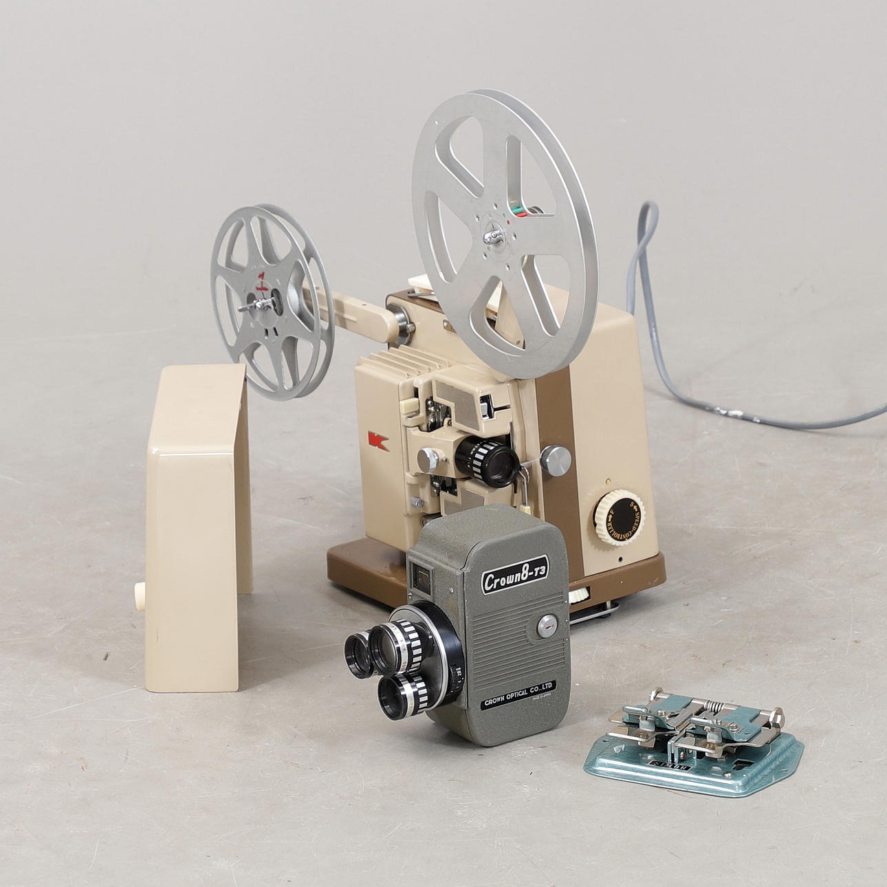 PROJECTOR, FILM CAMERA, CUTTING TOOLS. 1950s.