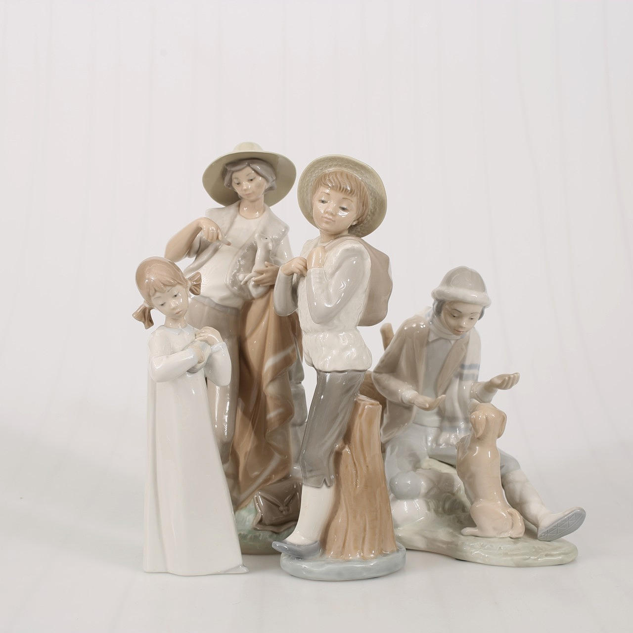 FIGURES, porcelain, Spain, 4 pieces.