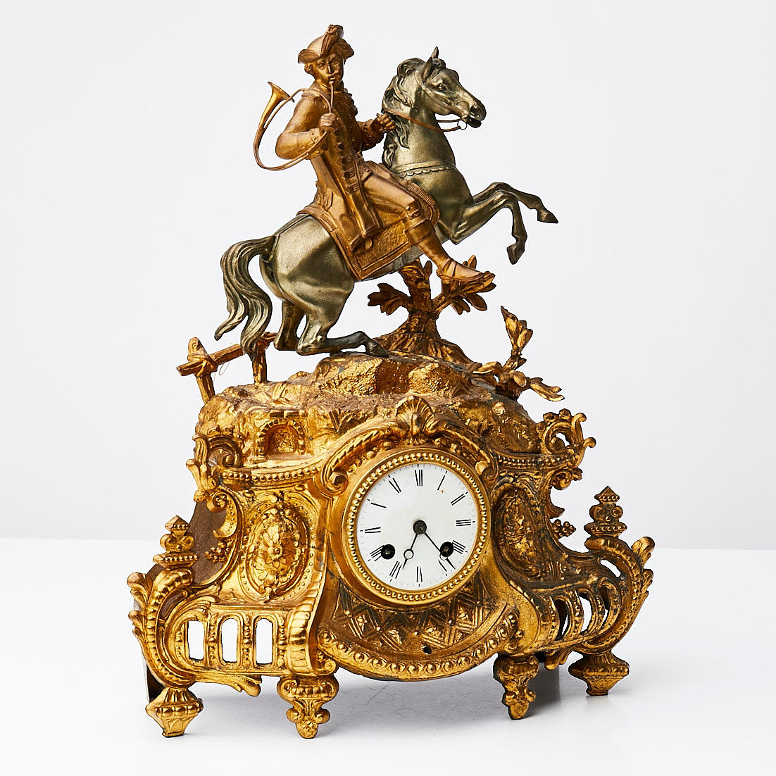 TABLE CLOCK, late 19th century, top with postilion, gilt and bronzed ...