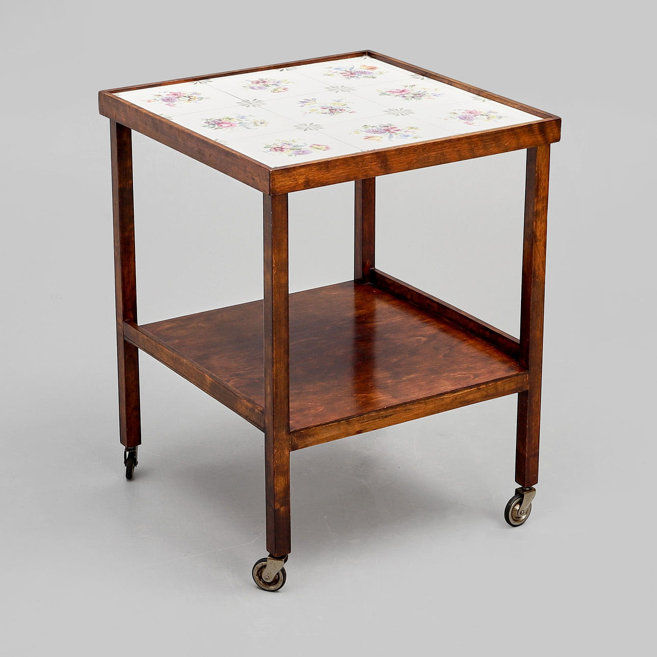NEWSPAPER TABLE with tiles and shelf.