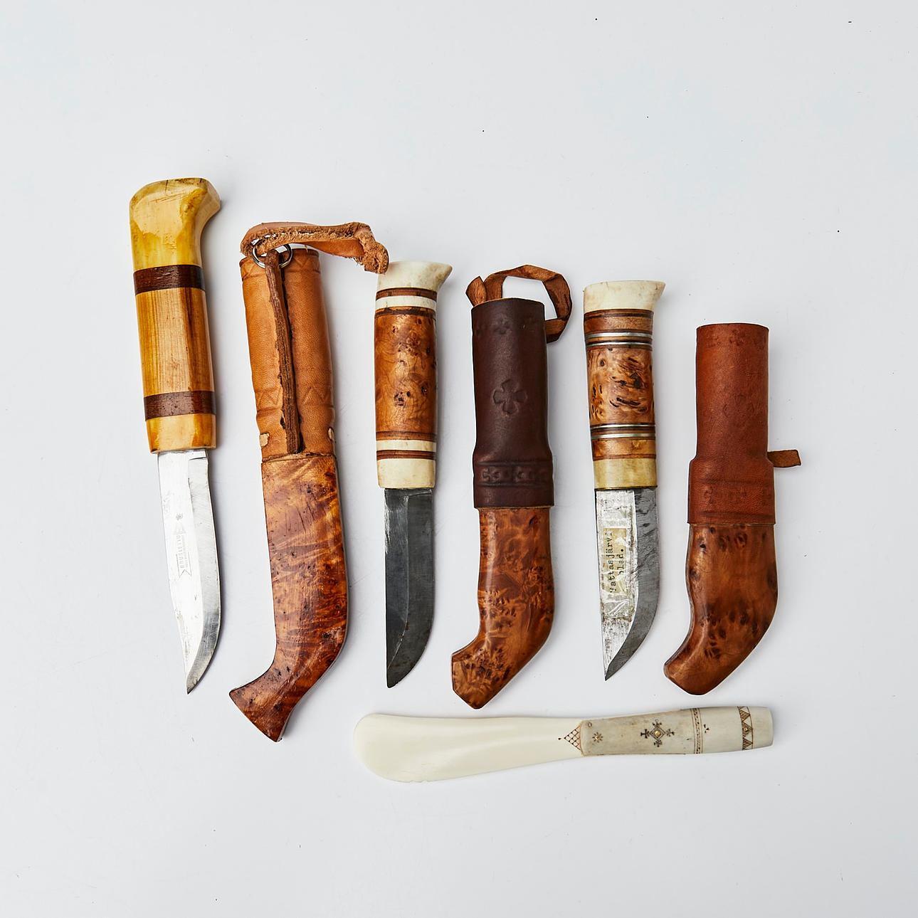 KNIVES, 3 pcs, Masur birch and details in reindeer antler, two signed AJS, included butter knife in reindeer antler.