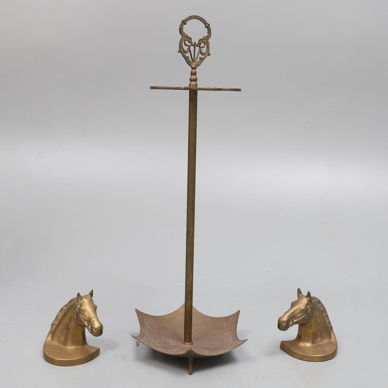 A MODERN BRASS STICK STAND.