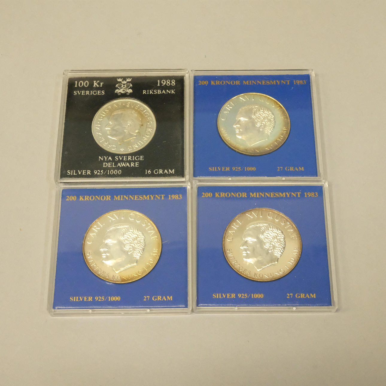 FOUR SWEDISH SILVER COINS.