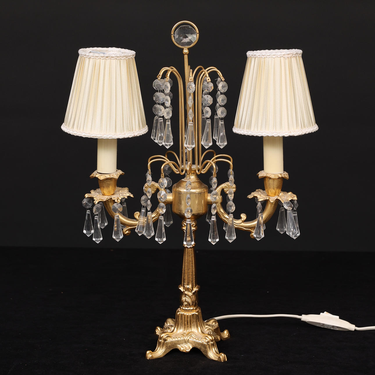 TABLE LAMP, yellow metal and prisms, two arms.