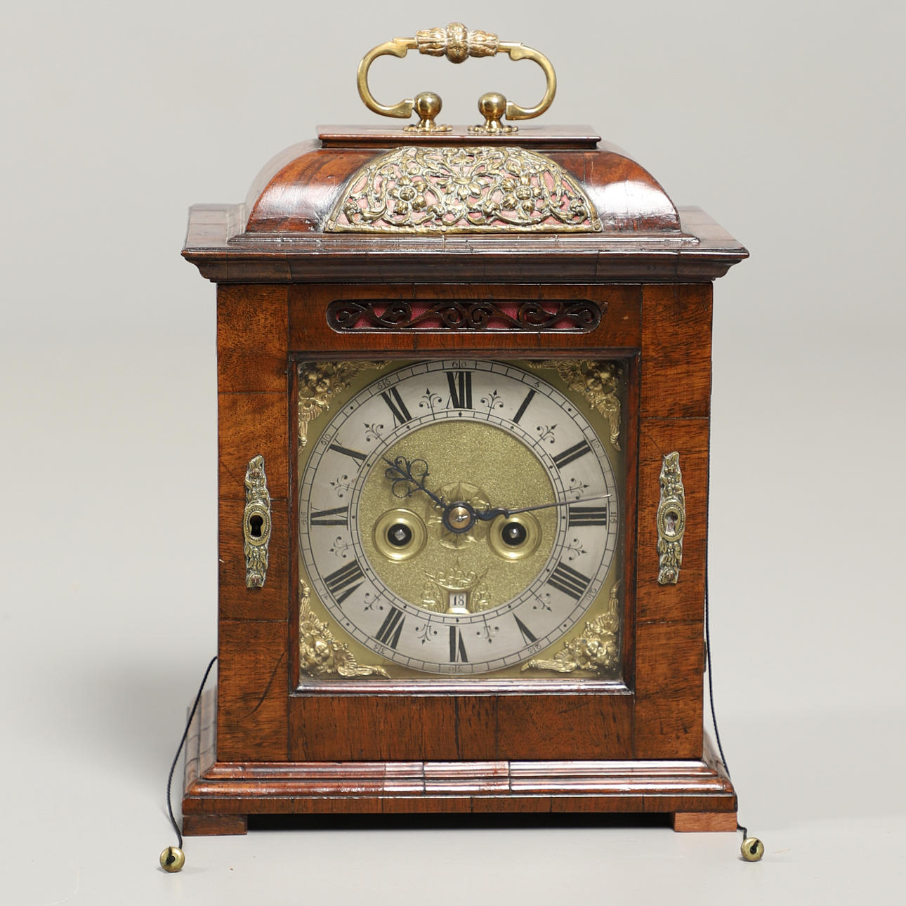A WALNUT BRACKET CLOCK.