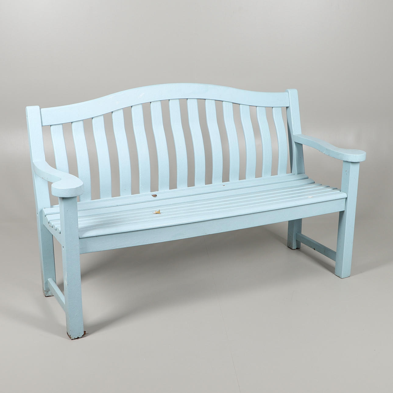 A BLUE PAINTED GARDEN BENCH.