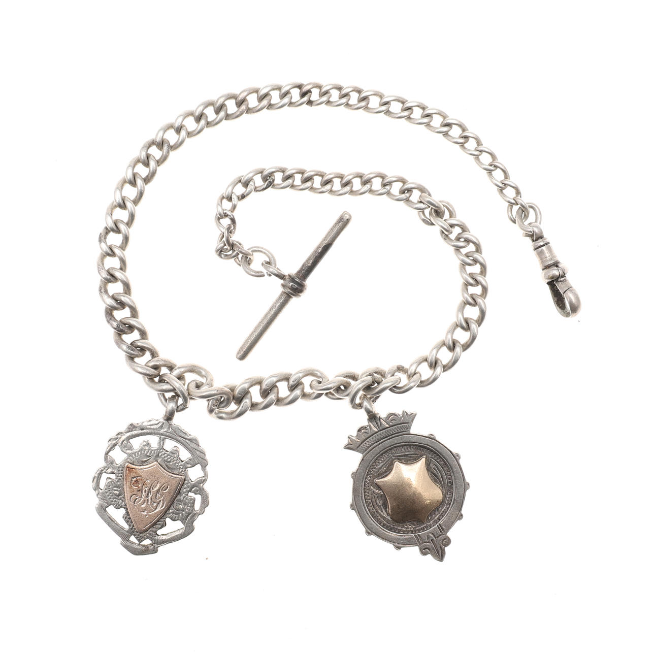 A SILVER WATCH CHAIN AND TWO FOBS.