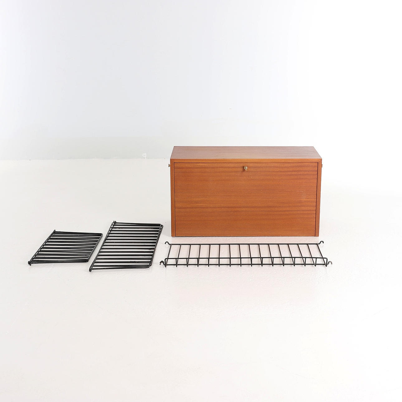 NILS STRINNING. 1917-2006, String shelf with cabinet module, 1950s.