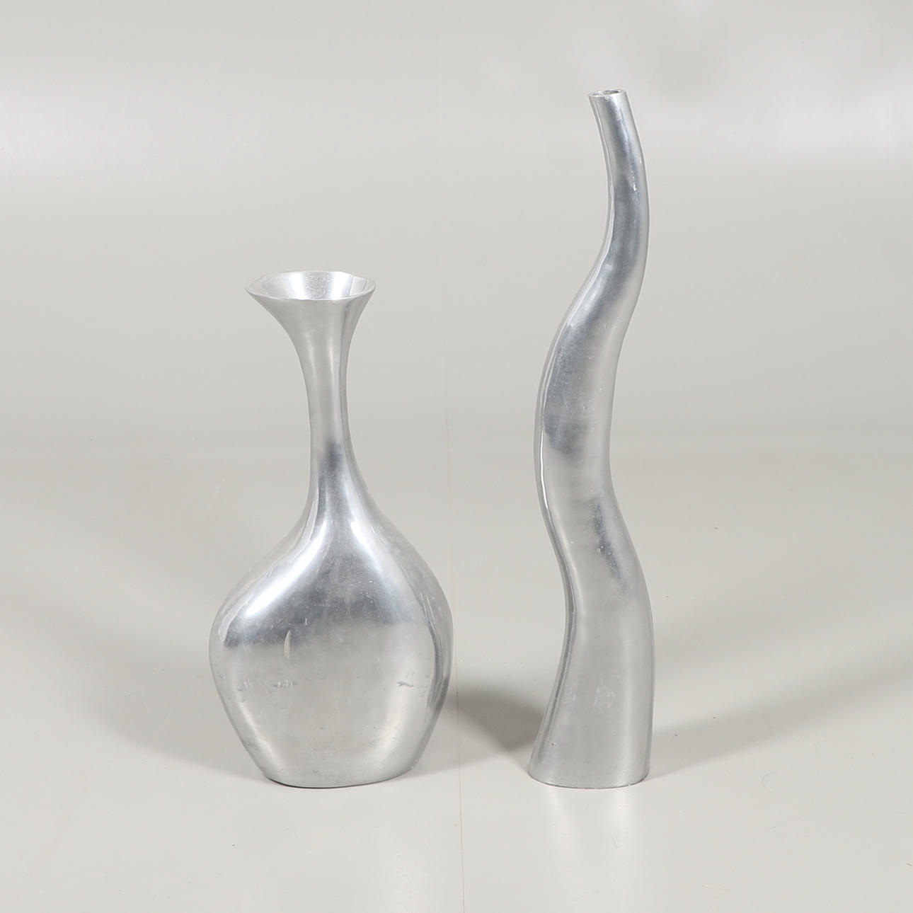 TWO CHROME METAL DECORATIVE SCULPTURES.