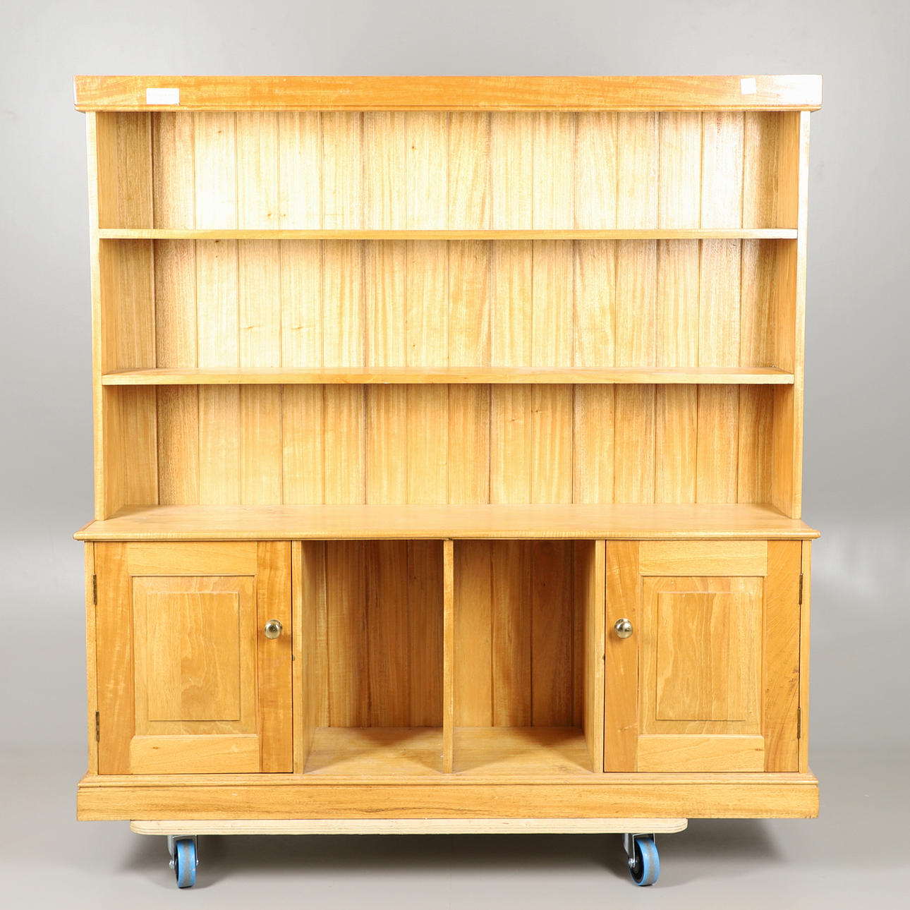 A LIGHT OAK DRESSER.